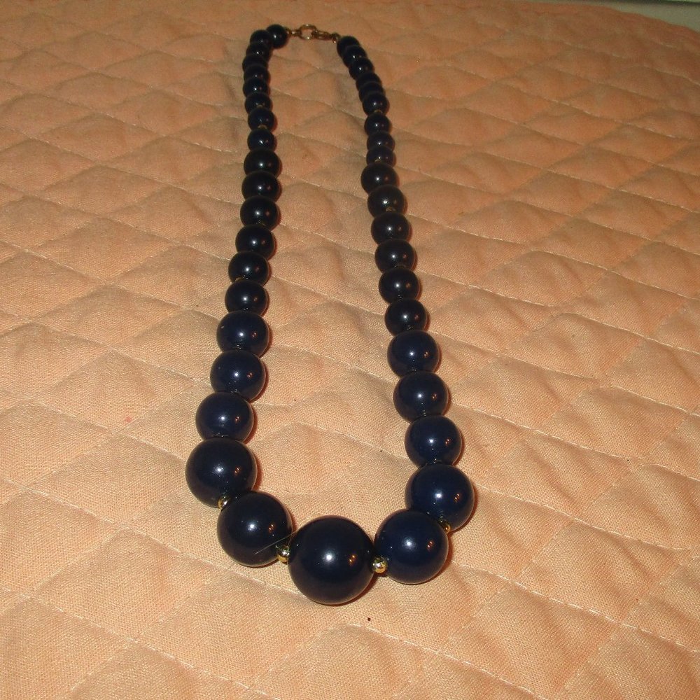Necklace Different sizes of round dark blue balls. 16" Please see photo